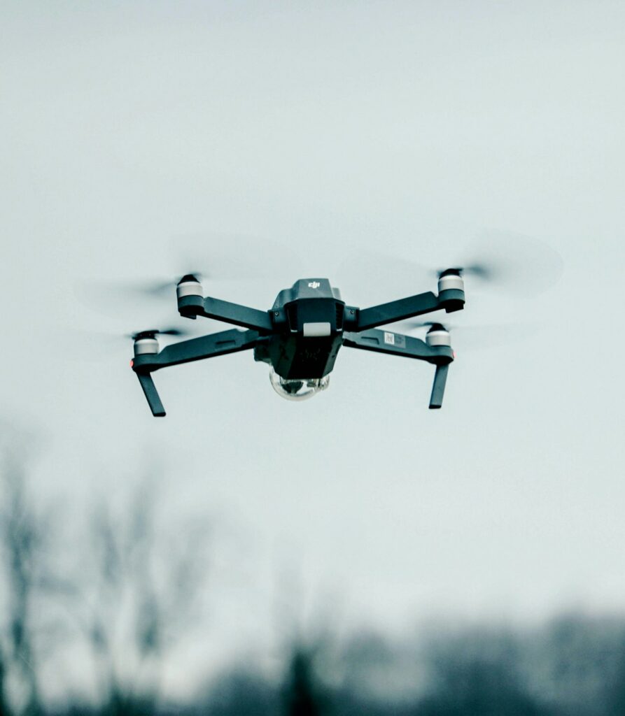 Quadcopter drone in flight illustrating common mistakes to avoid in drone photography