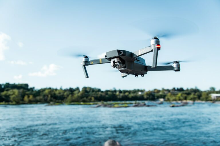 A DJI Mavic drone near a body of water, illustrating drone maintenance
